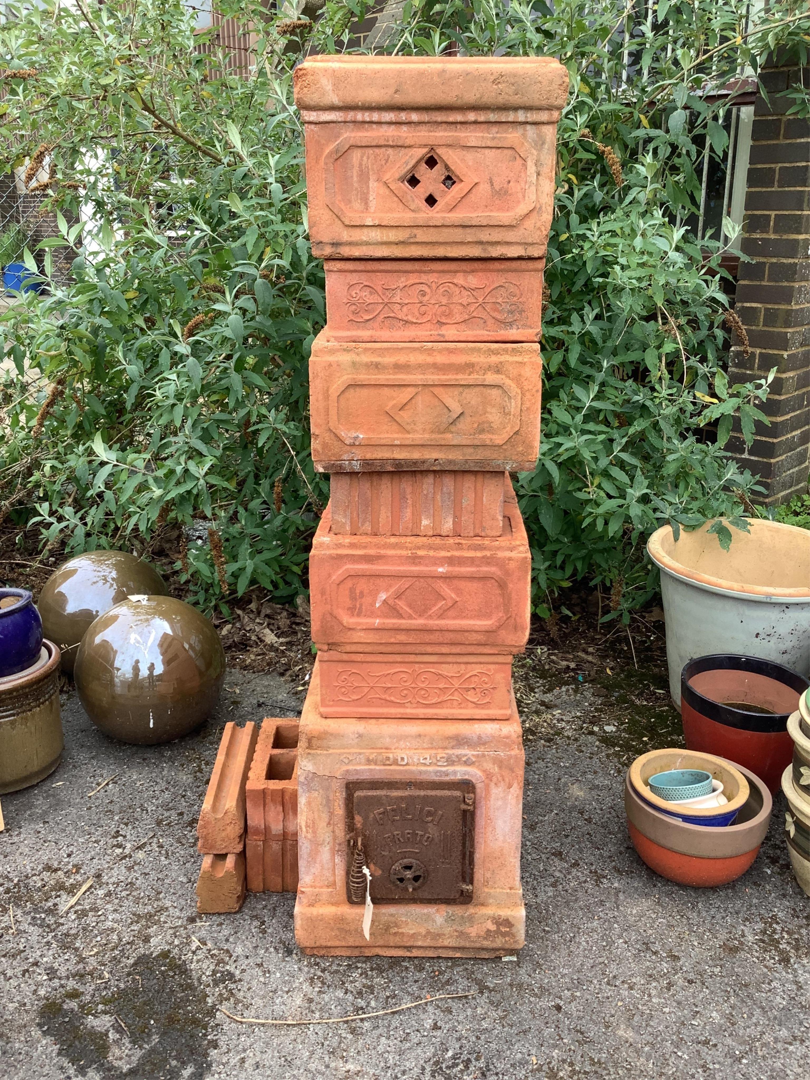 An Italian Felici Prato terracotta sectional garden stove, height 141cm